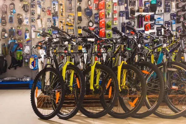 A colorful 7-speed or 8-speed bicycle displayed in our shop, surrounded by various cycling accessories.